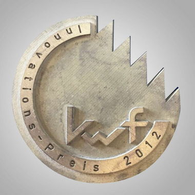 Plaque for innovation prize featuring industrial design, labeled 'preis 2012'