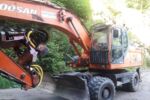 Baggerprozessor DOOSAN DX210W mit WOODY60